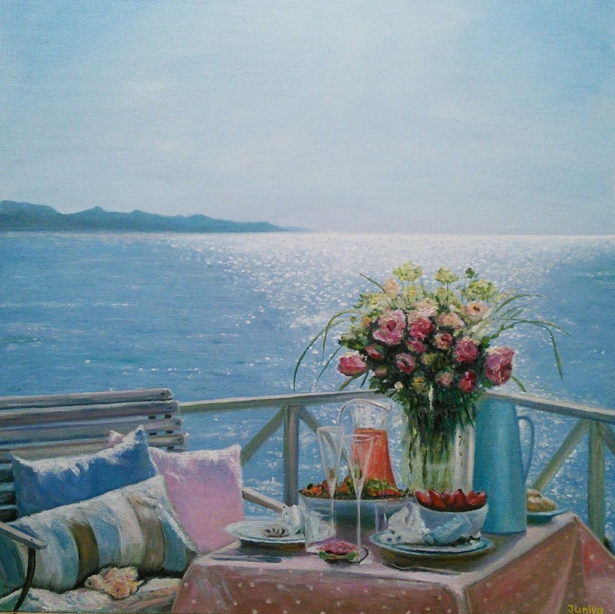 Picture of the table with served breakfast near the sea