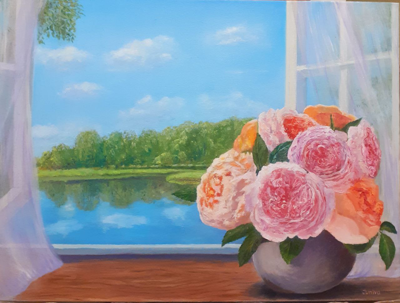 A Bunch of pink flowers on the window sill with a view to summer landscape